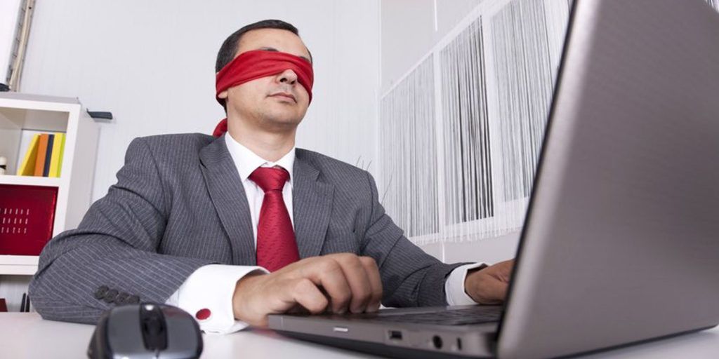 a man with a blindfold symbolizing the need for websites to use ADA compliance