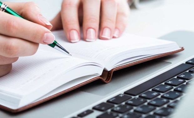 a person writing content in order to employ great inbound marketing strategies and generate new and more business leads than before