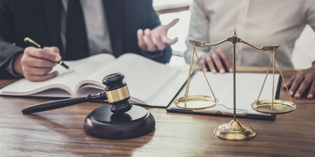 an attorney speaking with a new client after receiving digital marketing for law firms