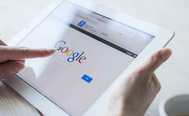 person using google on their tablet