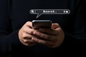 person using smartphone for online search internet mobile technology
