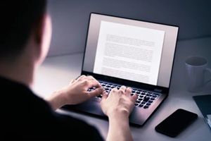 writer writing content or blog with computer