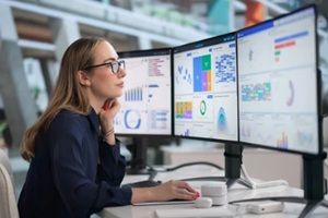 young financial analyst reviews business data
