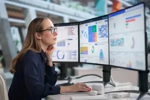 young financial analyst reviews business data